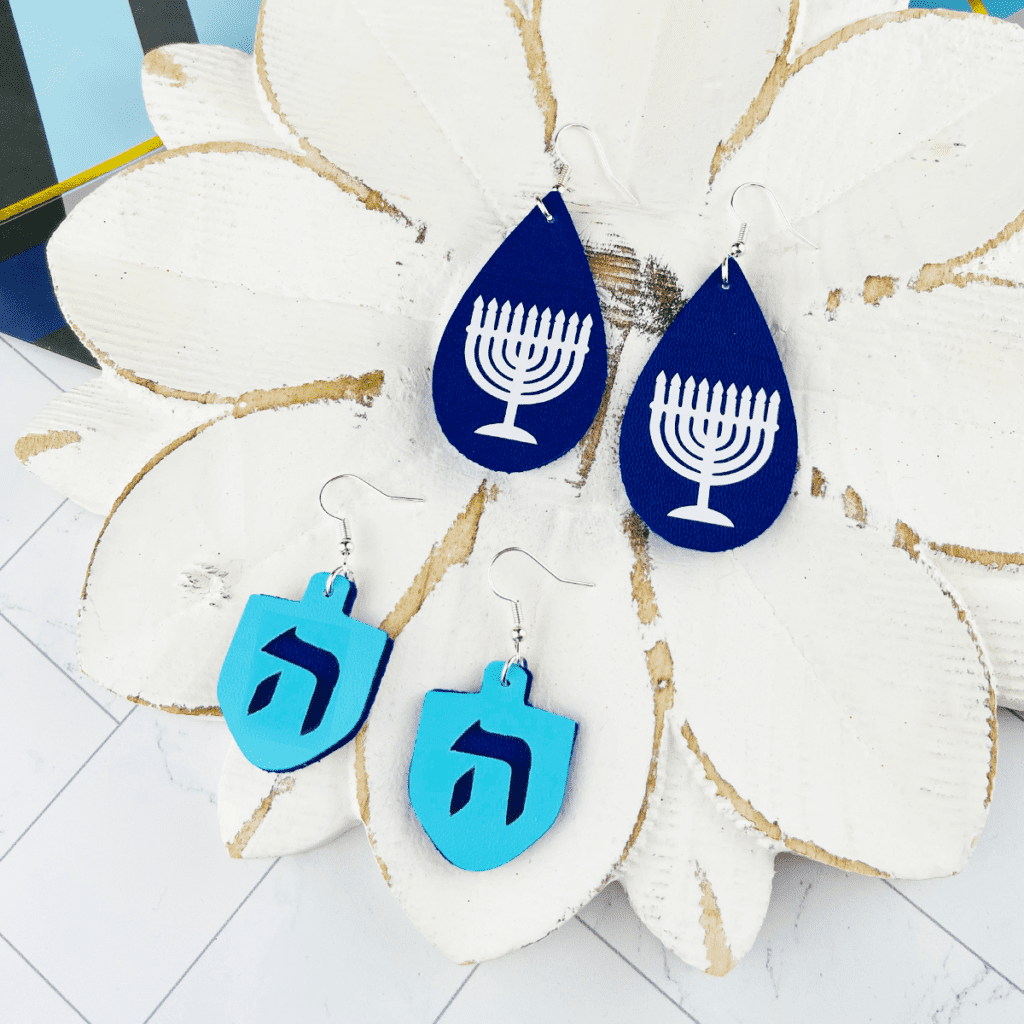 dreidel and menorah earrings made with a Cricut