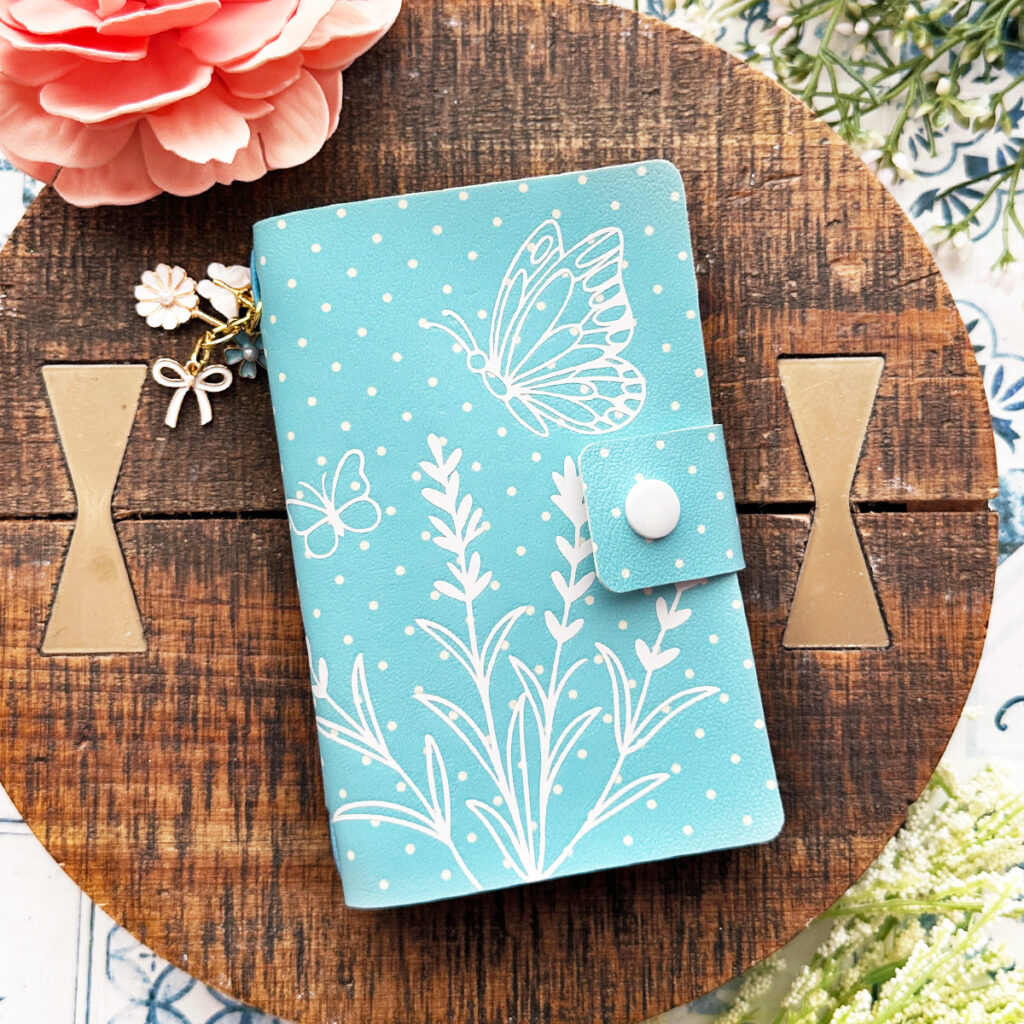 Faux Leather Spring Notebook Cover made with a Cricut