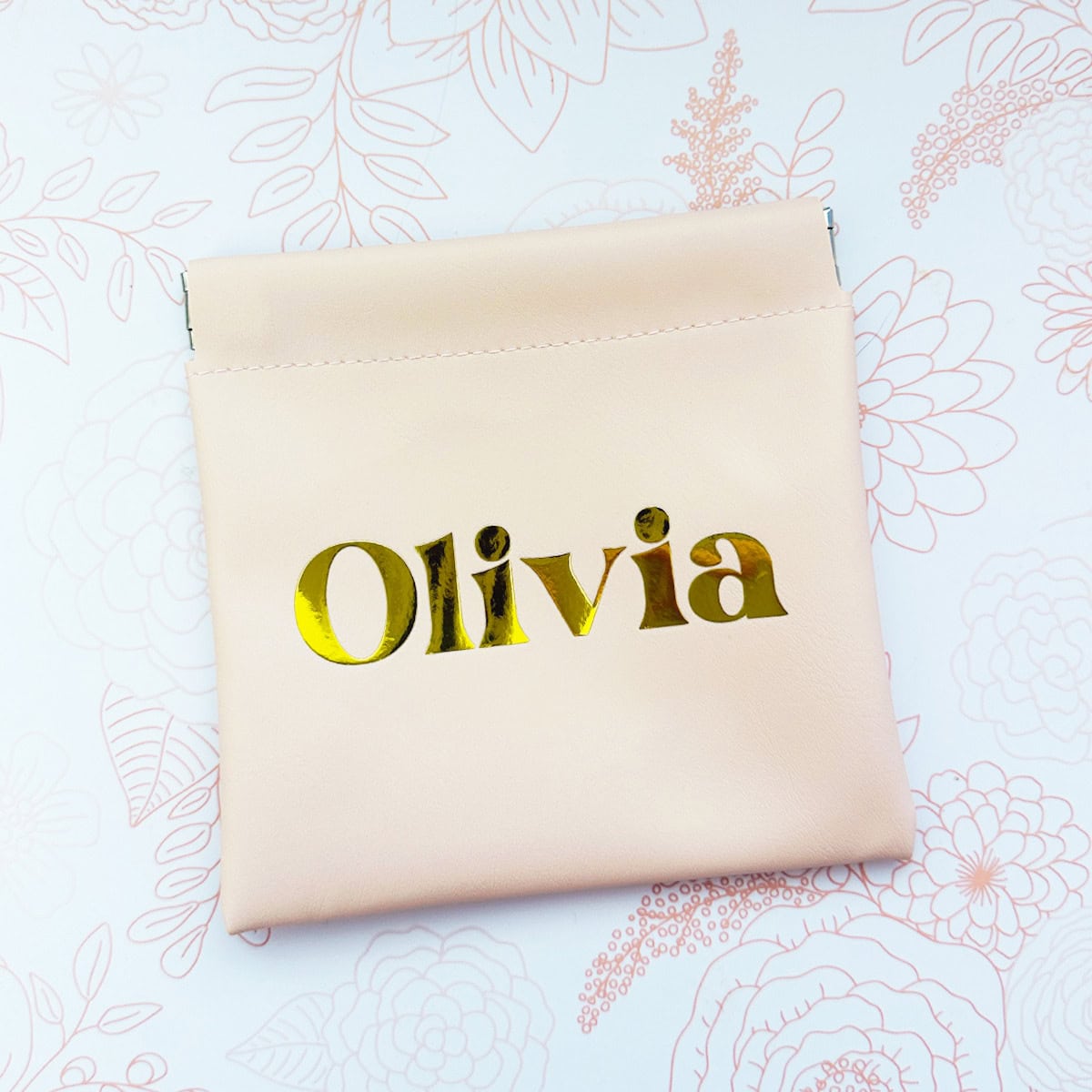 faux leather pouch with a heat transfer vinyl name applied