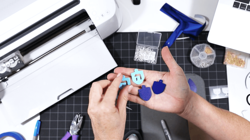 cutting faux leather for dreidel earrings