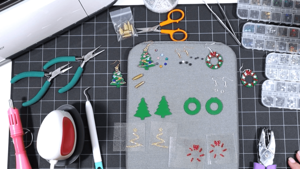 faux leather and vinyl shapes cut for Cricut Christmas tree earrings