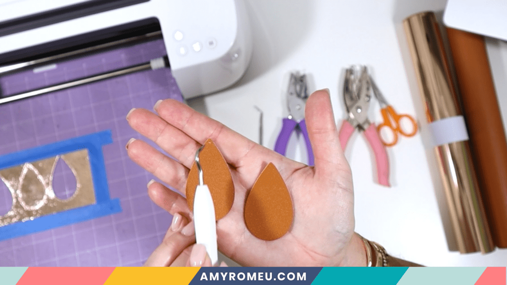 using sharp tool to make earring holes