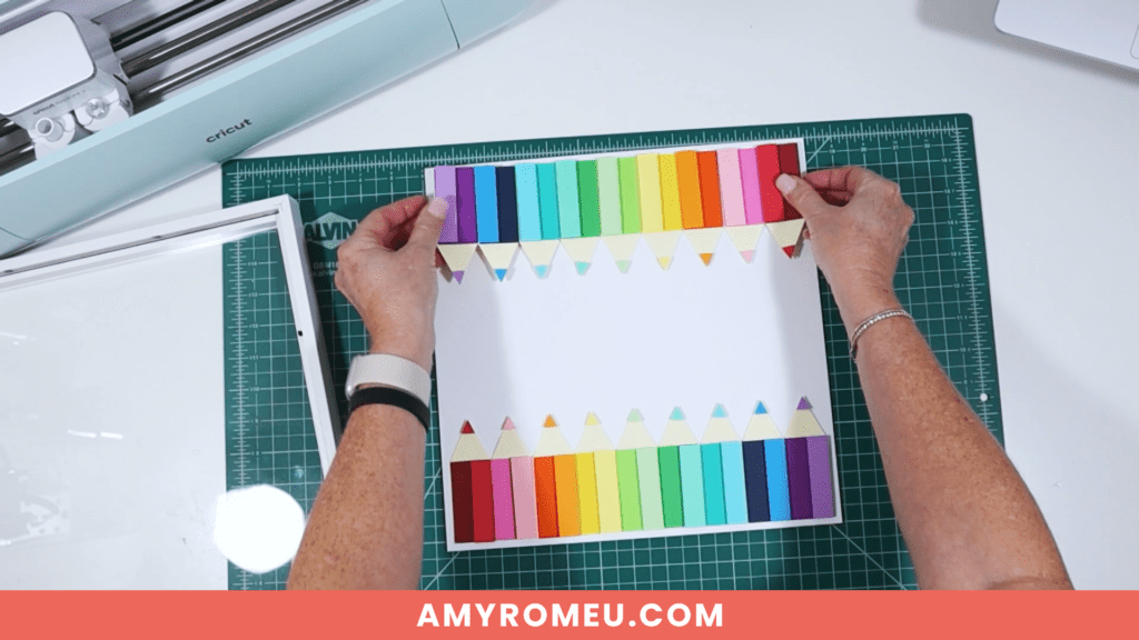 attaching colored paper layers to shadow box frame