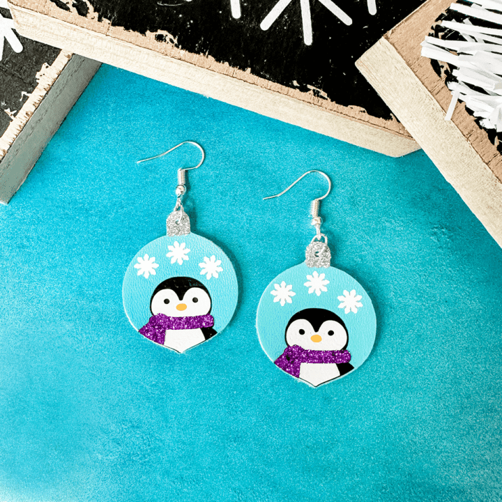 faux leather penguin ornament earrings made with a Cricut