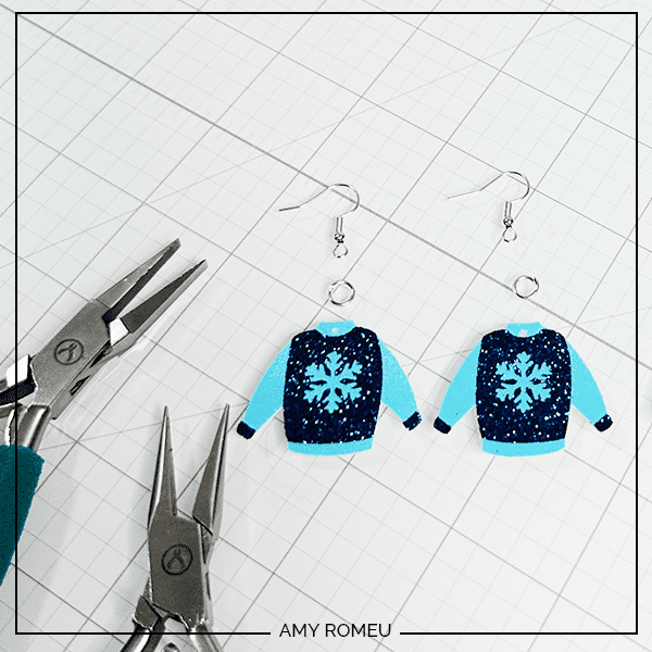 attaching earring hooks to peeling vinyl carrier sheChristmas Sweater earrings made with a Cricut