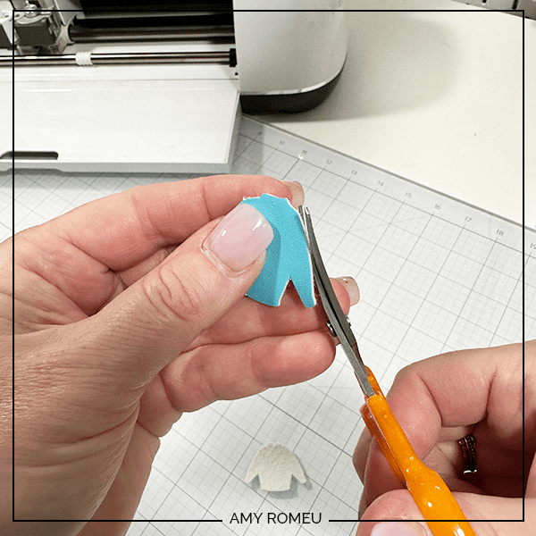 trimming faux leather with a Cricut for Christmas Sweater Earrings