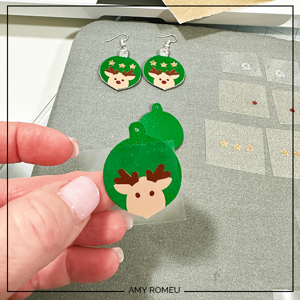 vinyl layers to press onto faux leather to make reindeer ornament earrings with a Cricut