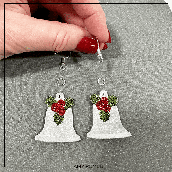 attaching earring hooks for for making Christmas Bell Earrings with Faux Leather and a Cricut