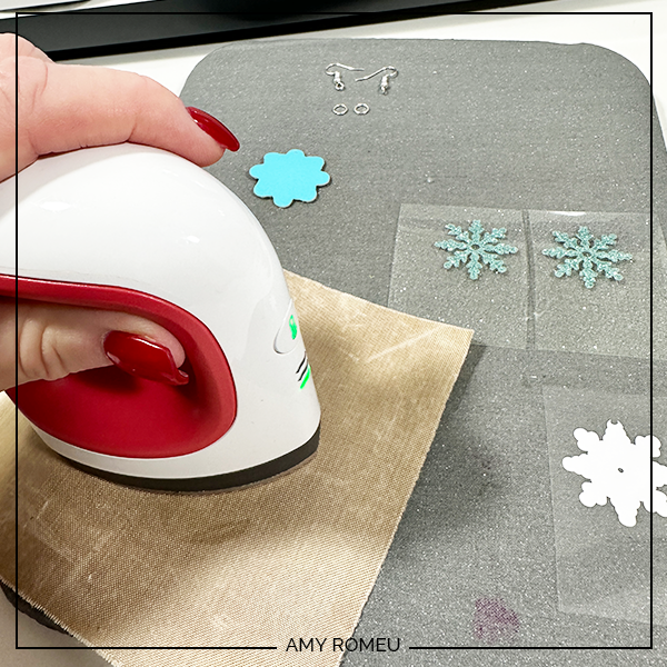 heat pressing vinyl for faux leather snowflake earrings made with a Cricut