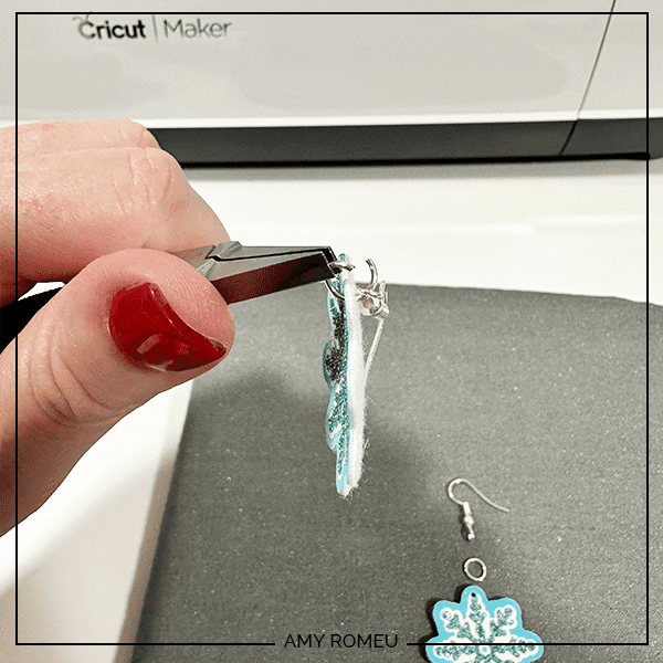 attaching earring hooks to faux leather snowflake earrings made with a Cricut