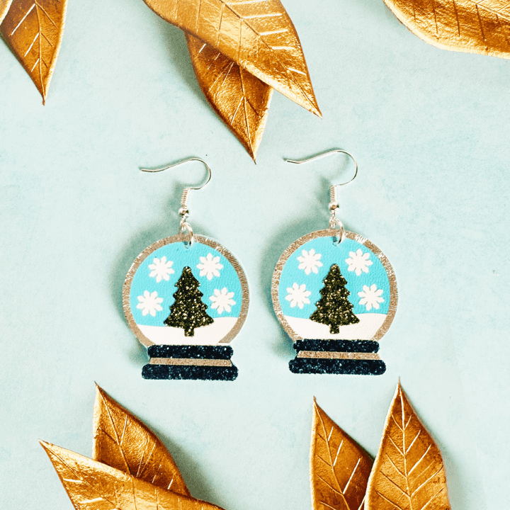 faux leather snow globe earrings made with Cricut