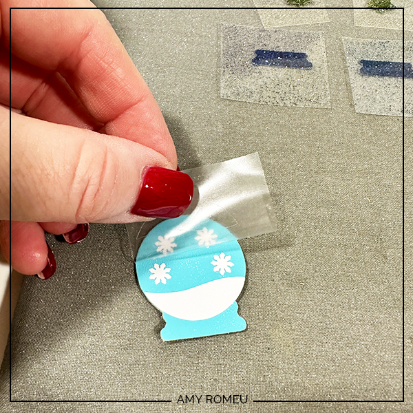 peeling vinyl cover sheet to to make faux leather snow globe earrings with Cricut