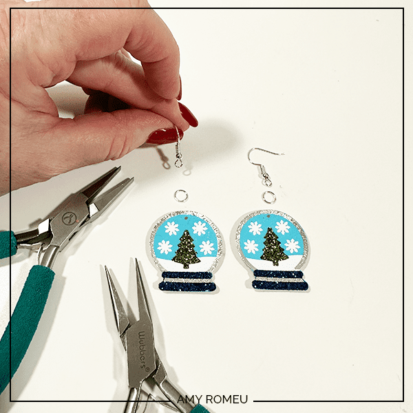 attaching earring hooks toto make faux leather snow globe earrings with Cricut