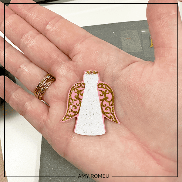 pressed layers during making faux leather angel earrings with a Cricut