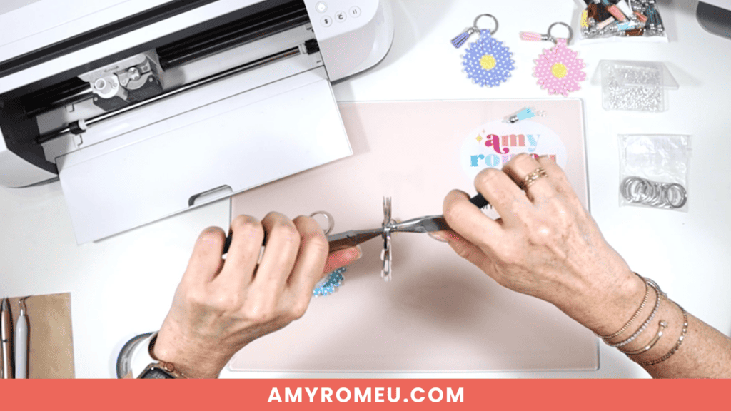 attaching a tassel to a faux leather daisy keychain