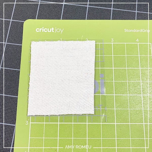 cricut joy cutting faux leather for earrings on green joy mat