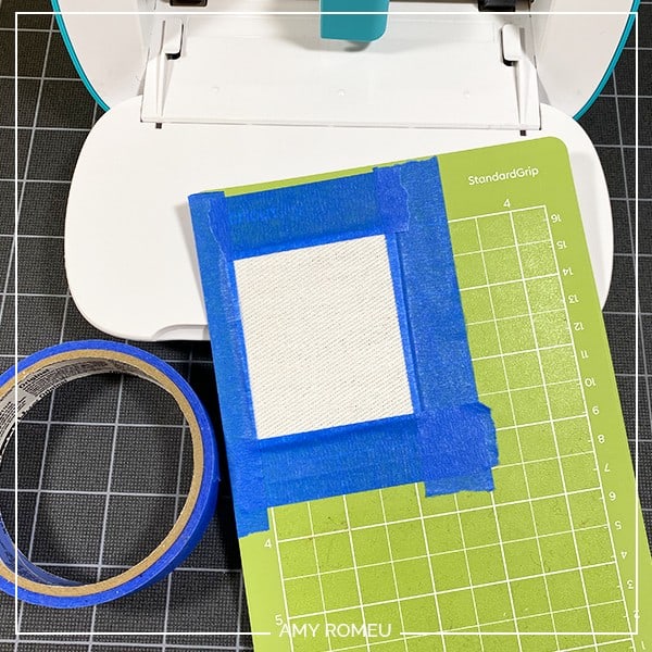 taping faux leather to cricut joy mat to make earrings