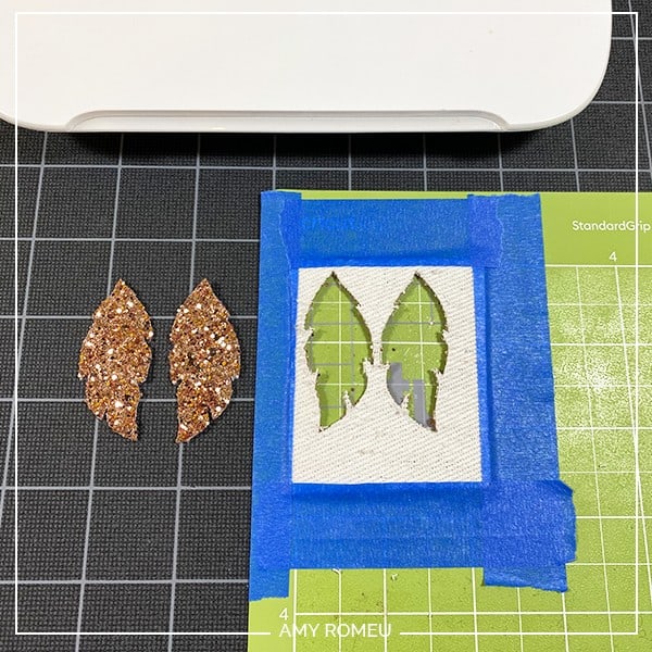 glitter feather faux leather earring shapes removed from a Cricut Joy cutting mat