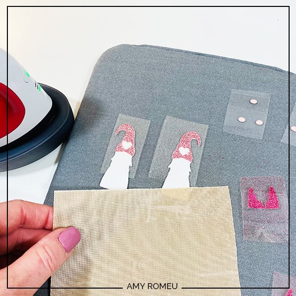 heat pressing valentine's day gnome earrings with Cricut easy press mini