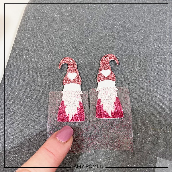 layering heat transfer vinyl for Valentine's Day Gnome Earrings