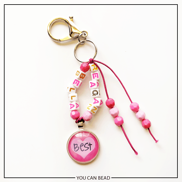 adding fringe beads to make best friend keychains made with letter beads.