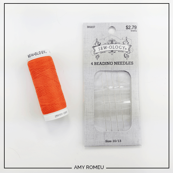 orange thread and beading needles