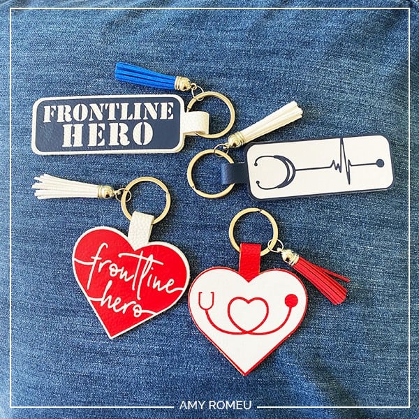 faux leather keychains with the words frontline hero and a stethoscope graphic