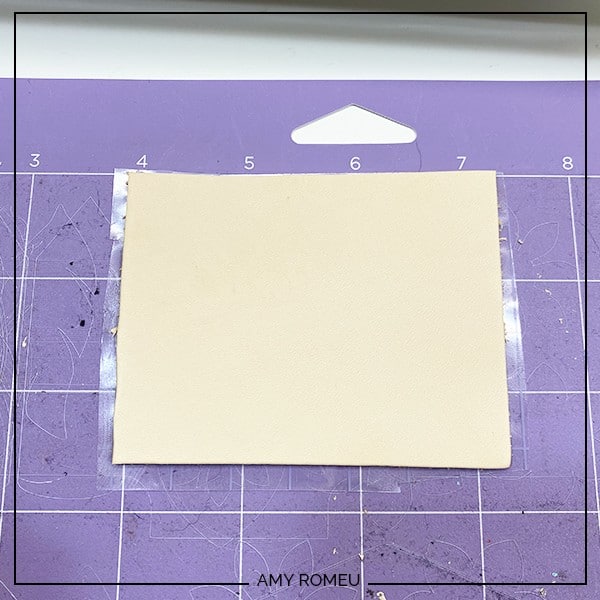 leather on transfer tape on a Cricut purple cutting mat