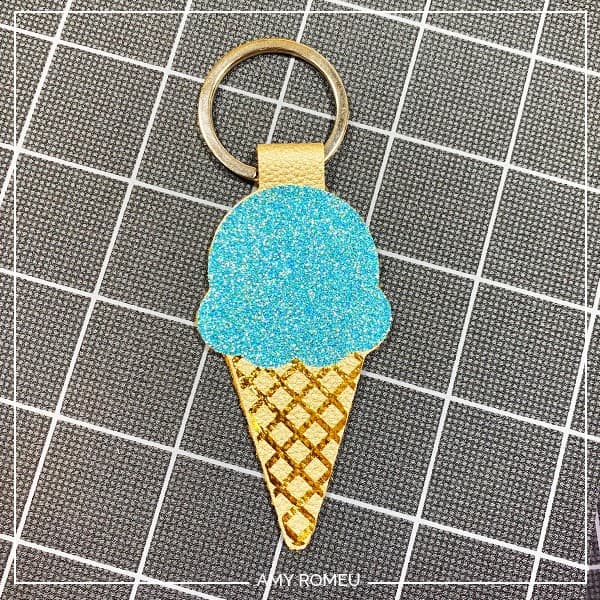 pressing front and back of faux leather cricut ice cream cone keychain