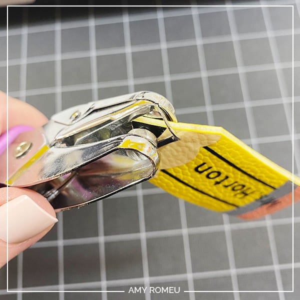 punching hole in faux leather pencil keychain