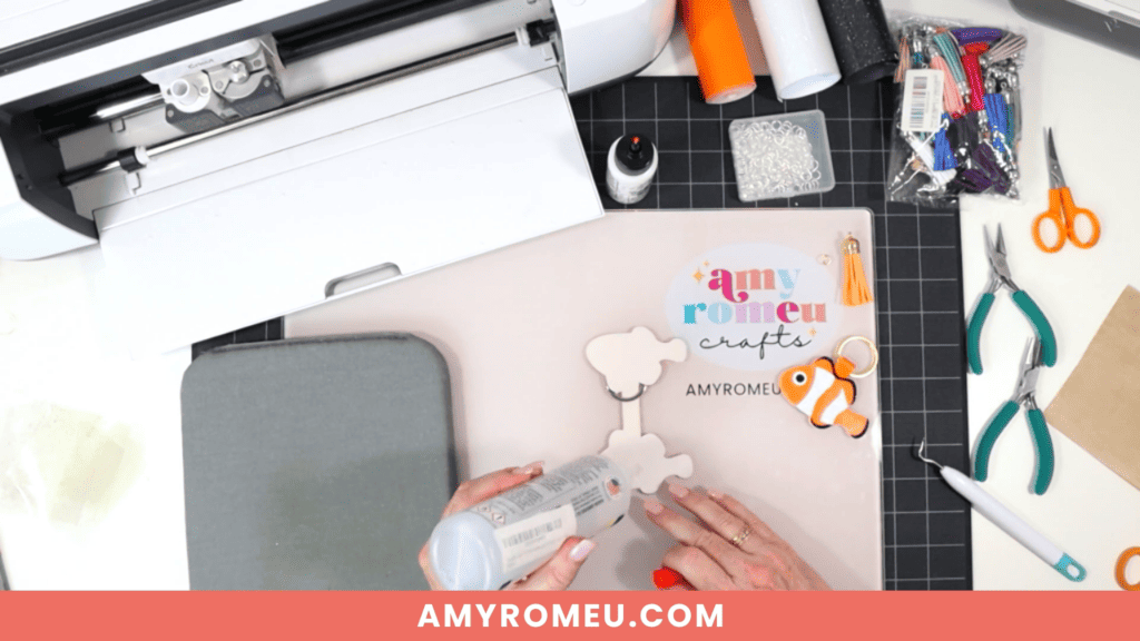gluing while making a clownfish faux leather keychain with a Cricut