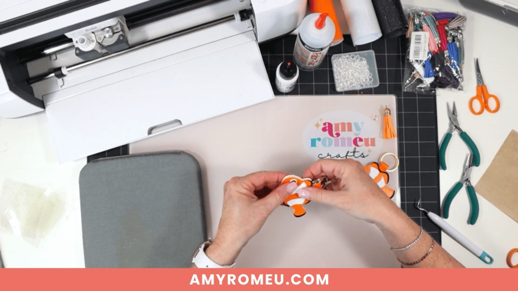 gluing while making a clownfish faux leather keychain with a Cricut